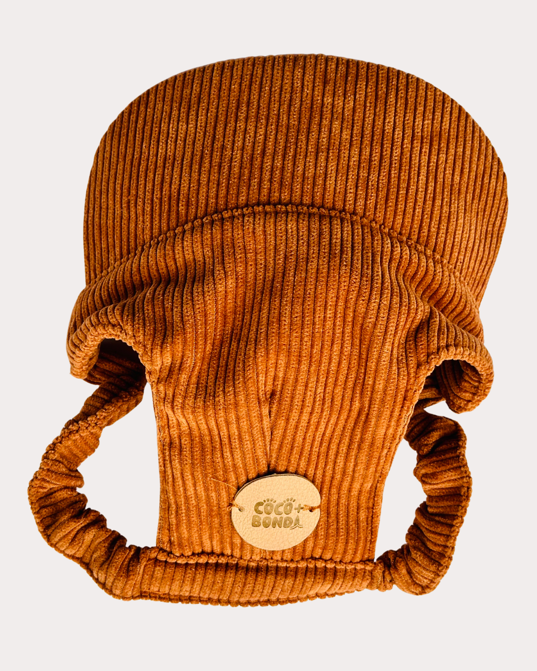 Brown ribbed knit baby hat with ear flaps on a light gray background